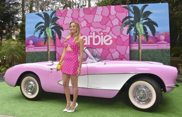 Margot Robbie arrives at a photo call for 