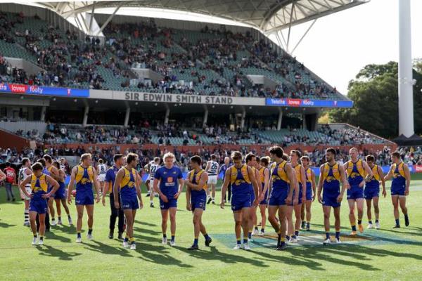 Eagles players take in the loss to Geelong.