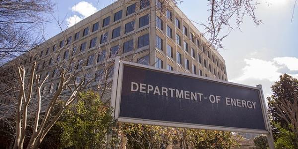 Signs stand outside the US Department of Energy (DOE) headquarters in Washington, DC, US, on Friday, February 14, 2020. 