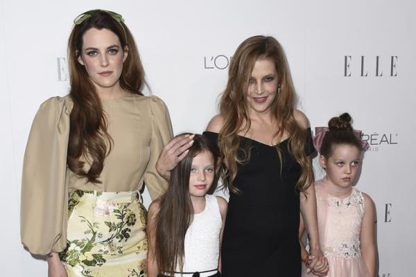 FILE - Lisa Marie Presley, second right, her daughter Riley Keough, left, and her twin daughters Finley Lockwood and Harper Lockwood, arrive at the 24th annual ELLE Women in Hollywood Awards at the Four Seasons Hotel Beverly Hills on Monday, Oct. 16<p><p class=