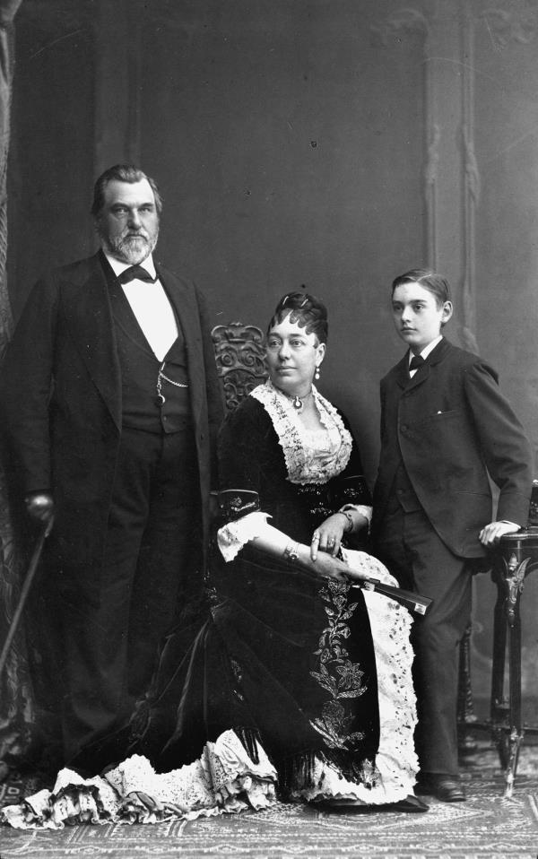 Black and white portrait of a man, woman and boy.