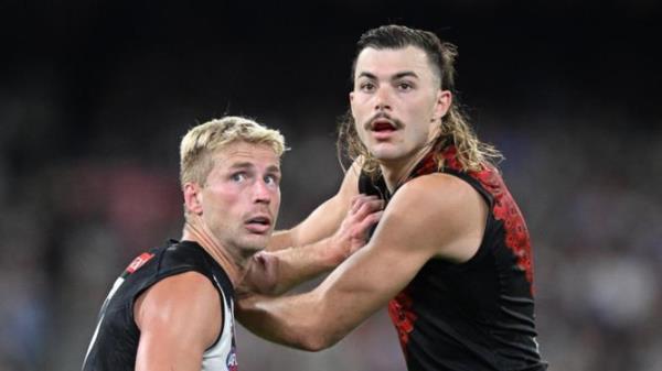 Sam Draper of Essendon (right).